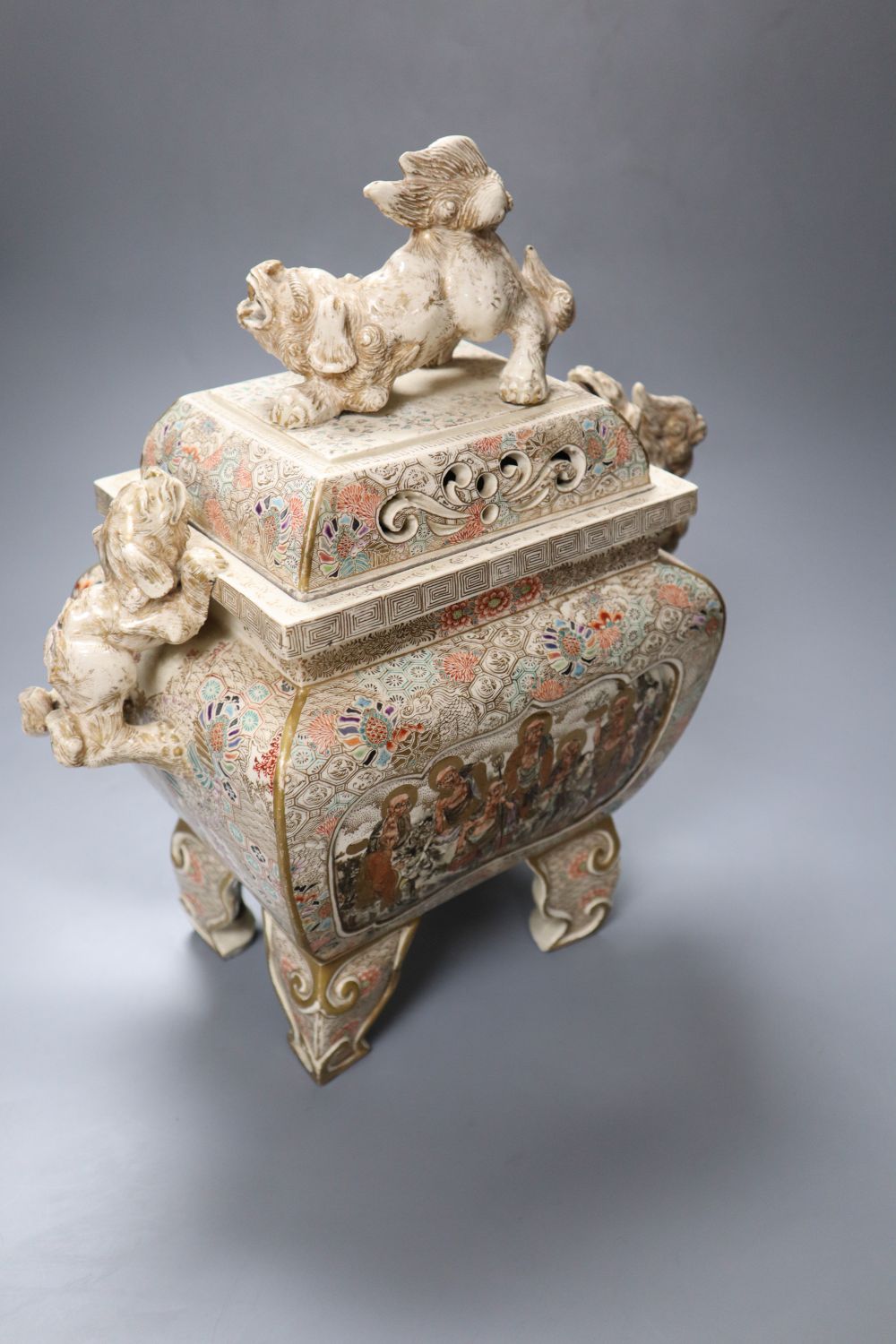 A large Japanese Satsuma pottery koro and cover, with Dog of Fo surmount and handles, 35cm high